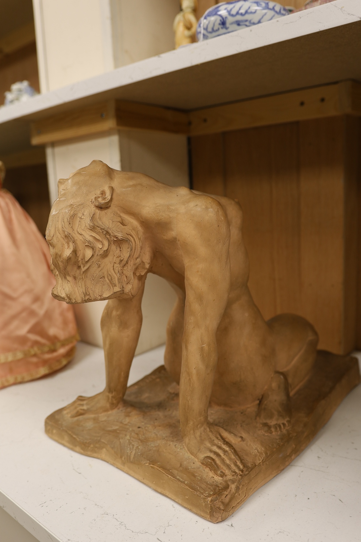 A French Art Deco terracotta semi reclining nude, stamped M. Lequesne, 36cm high. Condition - fair to good, slight scratches